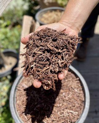 3/8" Decorative Wood Chips in Dark Brown. Made from recycled lumber waste from construction sites.