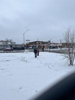 Kids playing in the snow on the Star Hotel lawn.