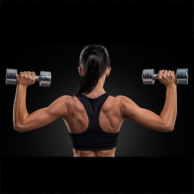 woman exercising with hand weights