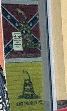 Confederate flags on display outside front window.  More inside.