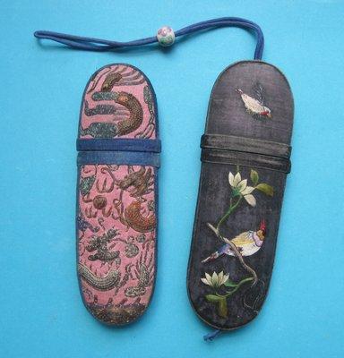 Two 19th-century Chinese spectacles cases decorated in embroidered silk.