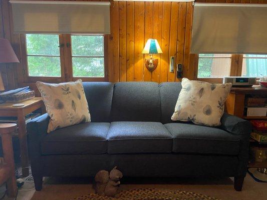 Navy blue sofa in log cabin