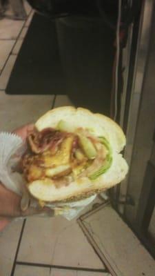 Chicken cutlet with bacon,lettuce and tomate on a hero.