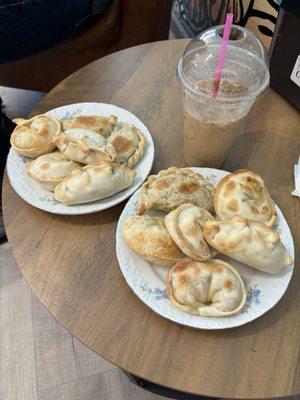 Cold latte with chicken, ham & cheese and beef empanadas.