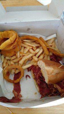 You get Salad, fries, zucchini and onion rings plus this stacked pastrami sandwich. Easy to share with a loved one. Great price too