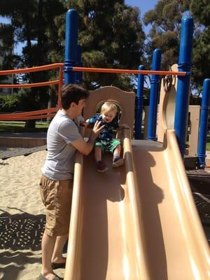 Small play area with 3 slides and a bridge.