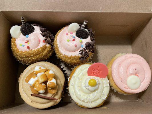 Top row: The Kitchen Sink cupcake Bottom row: Mayan Mocha cupcake, Lemon Drop cupcake, Raspberry Beret Cupcake