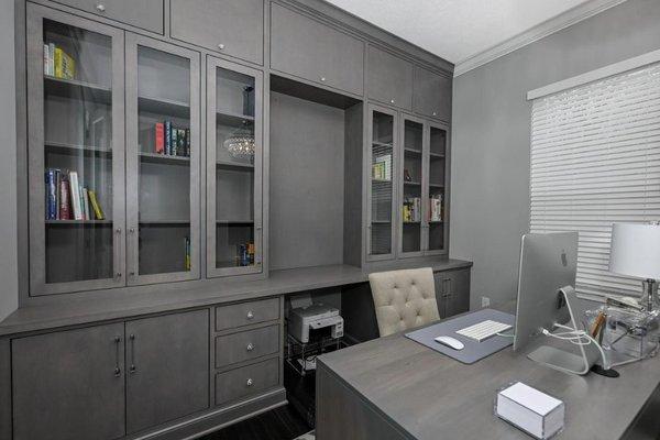 Cabinet Style: Astoria & Glass Doors
Wood Species: Maple
Paint Color: Gray Stain to match Client's Desk 
Design Team: DCC Strongsville