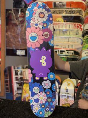 Custom Takashi Murakami grip tape put onto a GIRL x Sanrio 60th anniversary deck