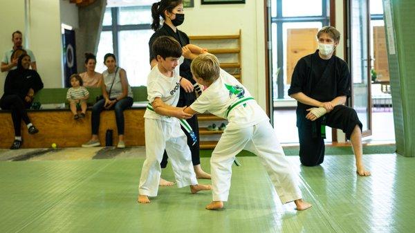 Kids martial arts classes at EvolveAll. Inside biceps control testing. This is a great technique for self defense training.