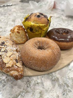 Almond croissant, macaroon, spice donut, blueberry muffin, chocolate donut