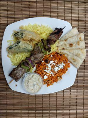 Build Your Plate with crispy fspanakopita and steak kabob.