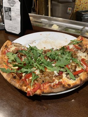 Italian sausage pizza with added mushrooms