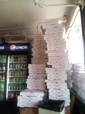 Wall of pizza boxes