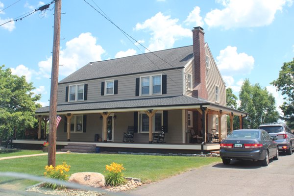 Front: Cedar Impression Vinyl Siding Sides & Back: Mainstreet Vinyl Siding