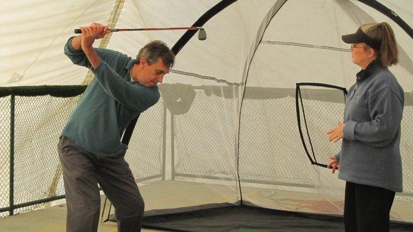 One of the training drills using the weighted club, designed to "build, maintain and repair the swing" Look at that ferris wheel. 2nd lesson