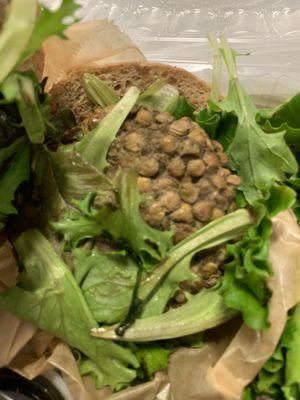 Inside lentil burger.  Think it should cover the WHOLE bun for $12.50.... Little pricey, but I needed plant-base