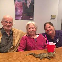 Caregiver Betsy with her two clients drinking root beer floats!