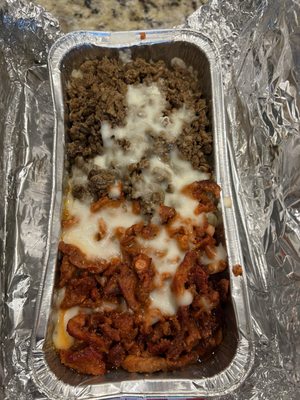 Baked potato smothered in beef and el pastor.  Absolutely delicious.