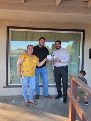 The Castañeda family receiving the keys of their first property, after renting for more than 20 years.