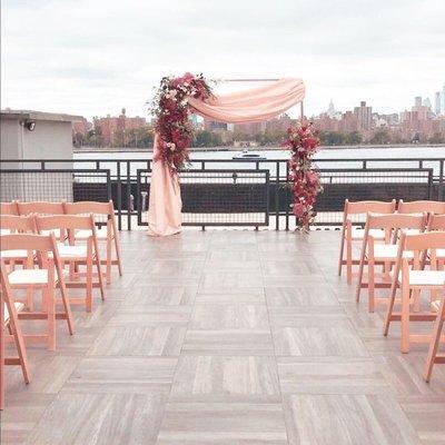 Wedding arch and natural wood folding chairs can be at your upcoming wedding.