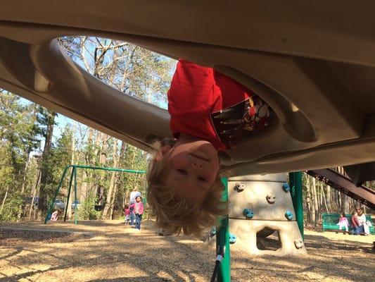 Peeking through one of the many play structures in the playground.