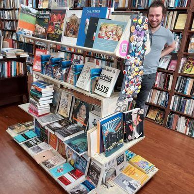 A display gondola overflowing with recent arrivals. Kris and Albert (not pictured) did the cool decoupage under all those books!