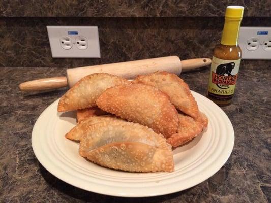 Hand crafted STUFT pies with Howler Monkey "Amarillo" Scotch Bonnet Pepper Sauce!