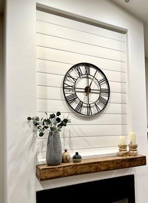 Shiplap accent wall with floating mantle.