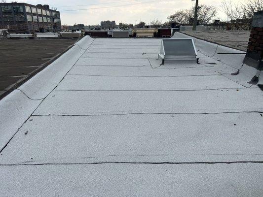 Certainteed white granulated rubber roof system and new skylight