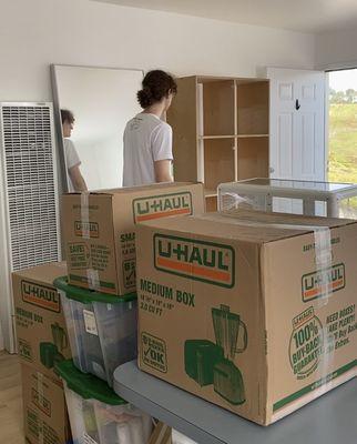 Boxes, glass hutch, tall book shelf