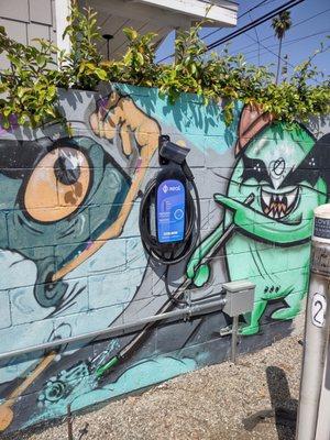 COIL installed Xeal EV chargers in a graffitied LA parking lot