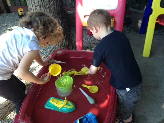 Aww! Water play on a hot summer's day!