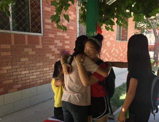 students saying goodbye in the summer camp