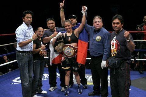 Ana "The Hurricane" Julaton captures the WBO Super Bantamweight Championship belt.