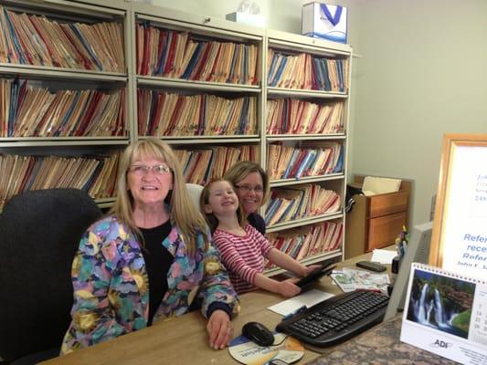 Sally and Chris in the office, with a young friend...