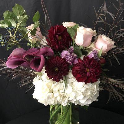 "Absolutely gorgeous arrangement - we are always so impressed with the creativity of the design and the quality of flowers!"