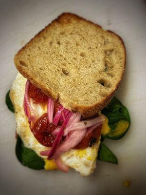 Breakfast sandwich served on house sourdough.