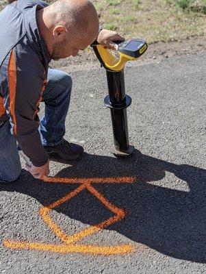 To avoid disrupting utilities, we use an electronic locating device that can read a signal wire buried underground.