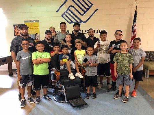 Barbers and members with cuts.