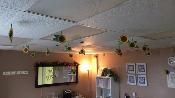 Every month we decorate the ceiling.  These are fall August sunflowers