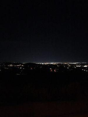 TJ is the patch of orange on the left after the obscuring dark hill, neat view of the city