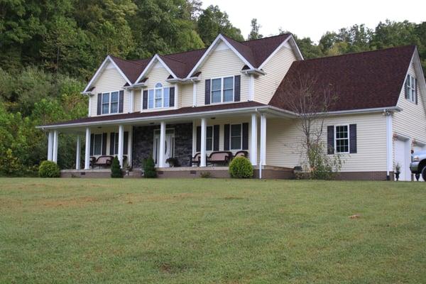 Rolling, tree-covered hills evokes a natural picturesque canvas for this captivating 2-story home...