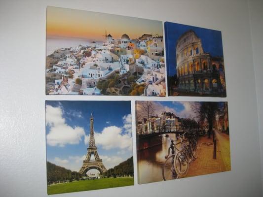 Canvases of my 4 favorite places in the world- Santorini, Greece; Rome, Italy; Paris, Italy; and Amsterdam, Netherlands.