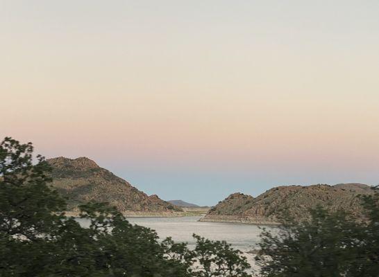 Sunset over the lake with the Wichita mountains in background