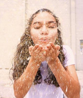 Model blowing glitter