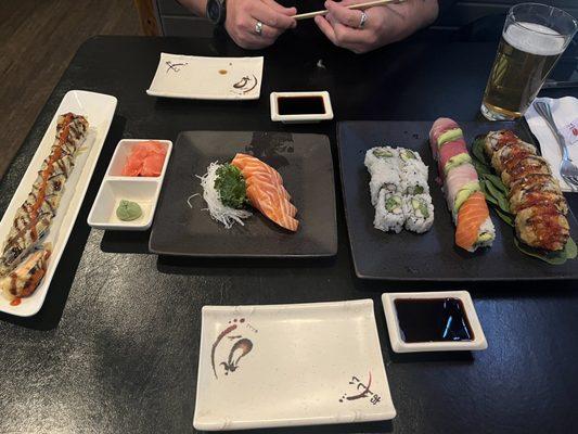 Cali roll, rainbow roll, yum yum crunchie roll, Sunday roll, and salmon sashimi