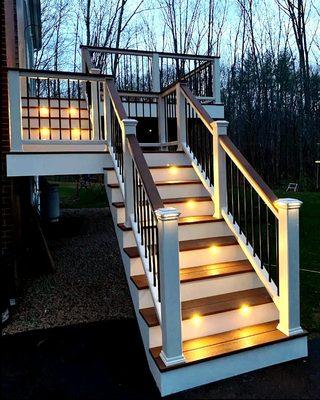 Simple yet elegant deck off the back door with some eye catching lighting.