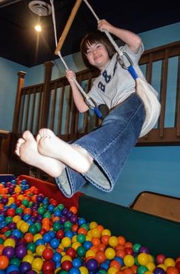 Seth swings way out over the ball pit.