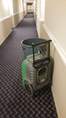 This dehumidifyer has been outside of our door for weeks. No AC in the hallway.